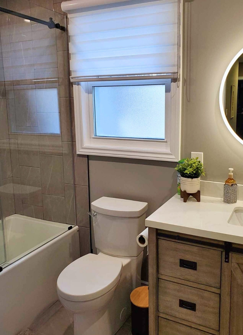 a newly installed white toilet beside a white tub